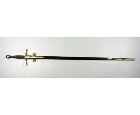 Masonic sword with a blued steel and gilt decorated blade and wire bound fish skin brass hilt, in a brass mounted leather sca