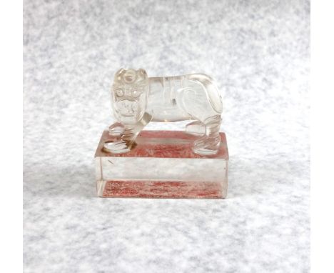 Late 19th century Chinese (Late Qing), rock crystal seal, in the form of a lion dog standing on a rectangular base with six c