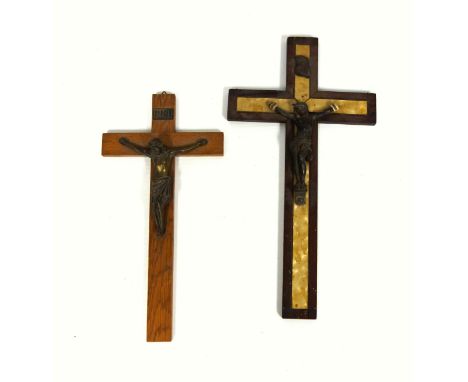 Wood and mother-of-pearl effect crucifix with a metal figure of Christ, H.35.2cm, and a smaller crucifix, H.30.1cm. (2)