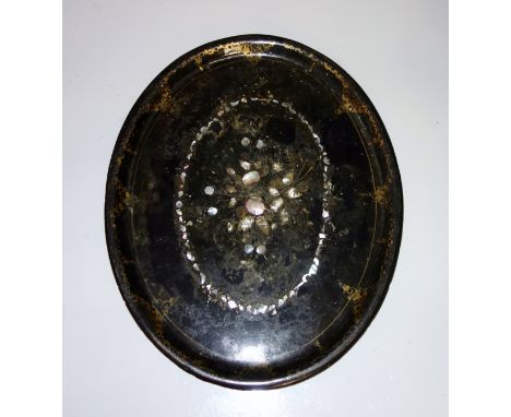 Victorian papier maché oval tray with inlaid mother of pearl and gilt decoration, W.76cm, (a/f); Eastern brass circular tray,
