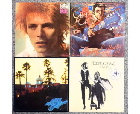 Quantity of 12 and 7 inch records including David Bowie, Fleetwood Mac, The Eagles, Electric Light Orchestra, Gerry Rafferty,