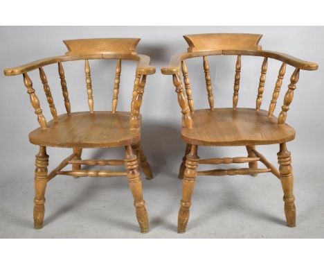 A Pair of Mid 20th Century Smokers Bow Arm Chairs with Spindle Backs 
