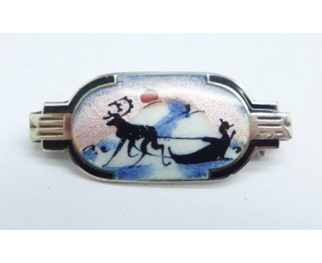 A small silver and enamel brooch, possibly Scandinavian, reindeer winter scene 