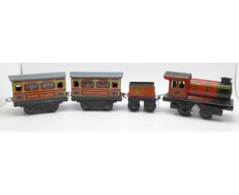 A Brimtoy tinplate locomotive, tender and two carriages 