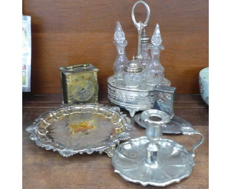 A silver plate on copper tray, a chamber stick, a/f, an Elkington plate matchbox holder, a four bottle cruet and a Smiths bra