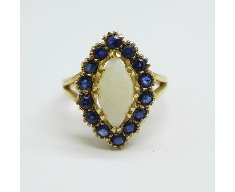 A 9ct gold, opal and sapphire ring, 3.5g, N 