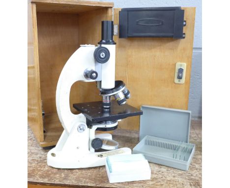 A Brunel cased microscope and a collection of slides 