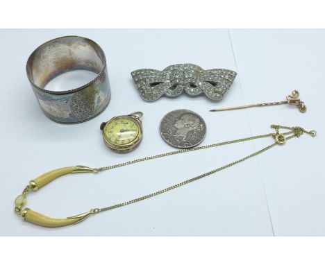 A plated napkin ring, rolled gold wristwatch head, stick pin, brooch/clip, necklet and medallion 