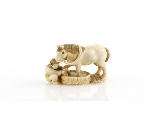 A stained ivory netsuke carved as a groom washing his horse, 20th CenturyProvenance: The Property of a Lady. From a Private C