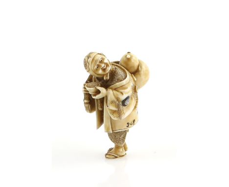 A  stained ivory netsuke of a standing man wearing tabi and waraji whilst holding a large gourd flask across his right should