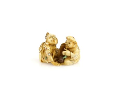 A stained ivory netsuke carved as Ebisu and Daikoku with Daikoku's mallet between them, 19th or 20th CenturyProvenance: The P