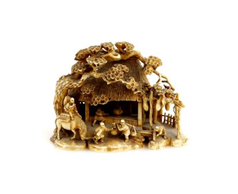 A stained ivory okimono carved as a thatched cottage with figures and pine trees, 8 cm diameter, signed ShinzanProvenance: Th