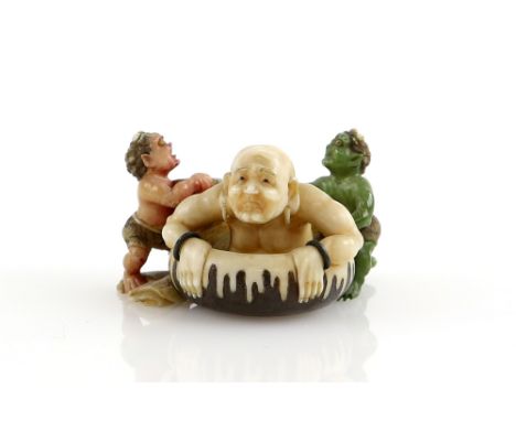 A Yasuaki (Homei) School, coloured netsuke of two Oni assisting a Sennin to bath; signed TomoyukiProvenance: The Property of 