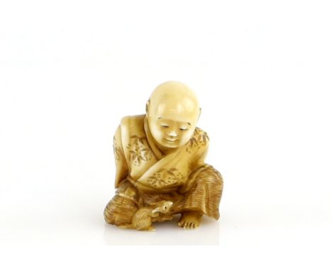 A stained ivory netsuke of the young Sesshu, seated beside his rat at The Sokokuji Temple, signed KogyokuProvenance: The Prop