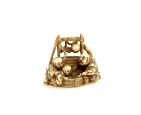 A stained ivory netsuke of a man and two boys around a tub, 19th CenturyProvenance: The Property of a Lady. From a Private Co