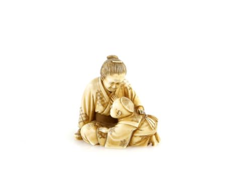 An ivory netsuke of a mother and child signed SeirinProvenance: The Property of a Lady. From a Private Collection acquired by