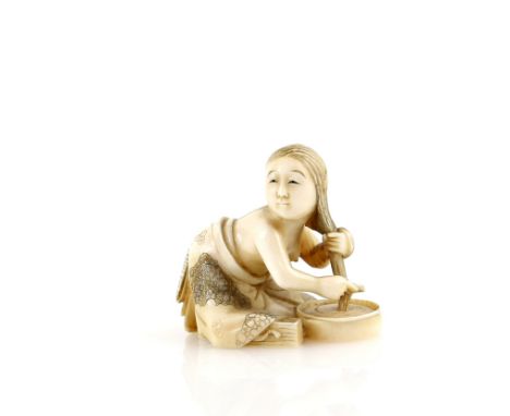 A stained ivory netsuke of a girl, washing her hair in a bowl, signed SeishiProvenance: The Property of a Lady. From a Privat