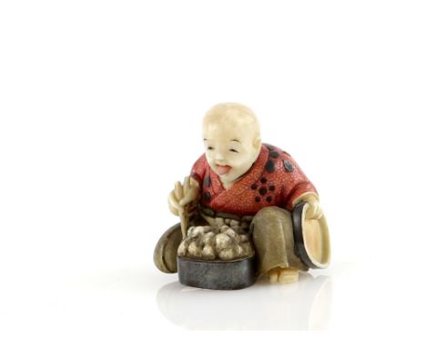 A Yasuaki (Homei) School coloured ivory netsuke of a seated boy with articulated head, eating from a bowl of fruit, signed Gy