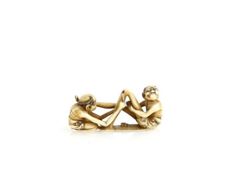 A stained ivory netsuke of Ashinaga and Tenaga seated opposite one another, 19th CenturyProvenance: The Property of a Lady. F