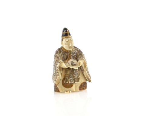 A lacquered ivory netsuke of a Sambaso Dancer or Noh Theatre Actor, wearing a mask and holding a fan, two kanji on the basePr