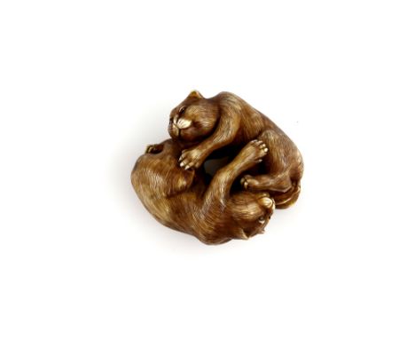 A finely rendered stained ivory netsuke of two cats, signed Naomitsu, late 19th or 20th CenturyProvenance: The Property of a 