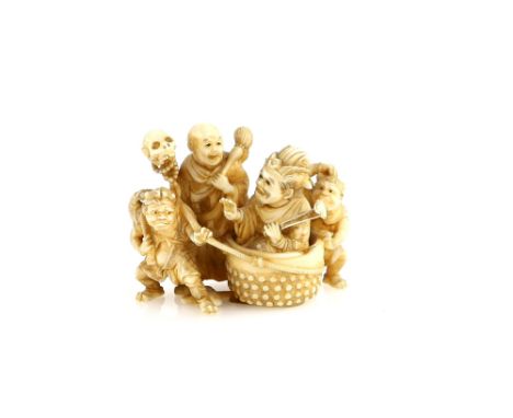 An ivory netsuke or small okimono, carved as Emma-O and Jizo Bosatsu beside a pair of Oni, 5 cm wide, Meiji PeriodProvenance: