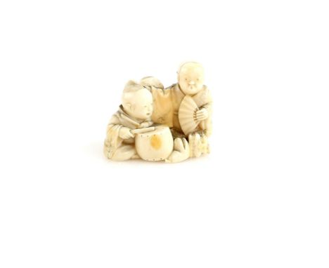 An ivory netsuke carved as three boys, one holding a fan and one with a drum, 19th or 20th CenturyProvenance: The Property of