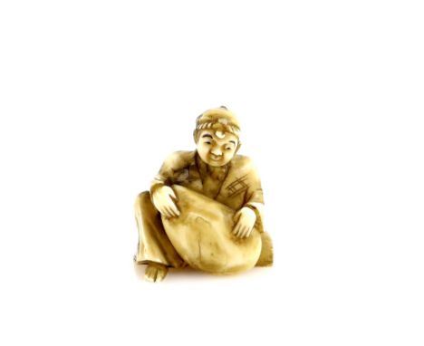 A small ivory okimono of a boy with a shell or boulder, 3.5 cm high, 20th CenturyProvenance: The Property of a Lady. From a P