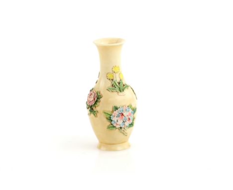 A small Chinese ivory vase, decorated on the exterior with floral designs, 6 cm high, the base with a seal or other design, 2