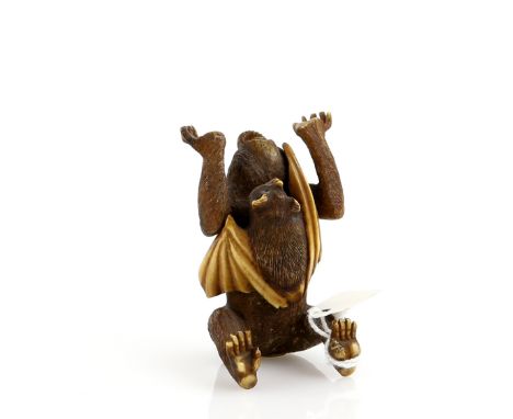 A heavily stained ivory okimono of a monkey, holding up both hands and being startled by a bat, unsigned, 20th CenturyProvena