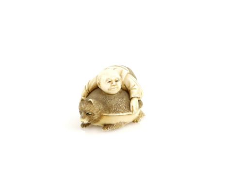 A heavily stained ivory netsuke carved as a Chabozu (or other character) holding a massive Bumbuku Chagama, 20th CenturyProve