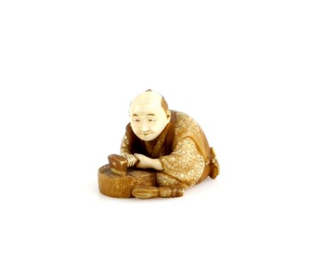 An ivory netsuke of a mill stone artisanProvenance: The Property of a Lady. From a Private Collection acquired by her Great-G