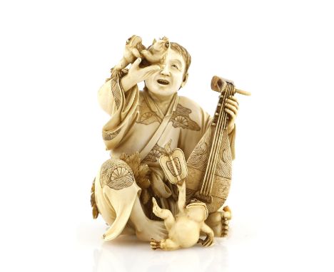 A stained ivory okimono carved as a seated musician,  holding a biwa with his left hand and a pair of frogs with his right ha