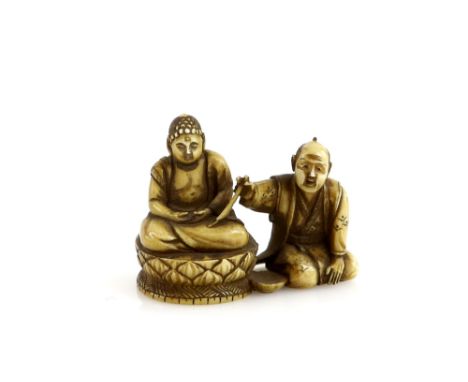 A stained ivory netsuke of a seated artisan lacquering a sculpture of The Amida with a brush, 20th CenturyProvenance: The Pro