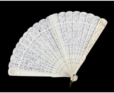 A Cantonese ivory fan with 20 sticks; each stick of typical reticulated form carved with designs of Manchu/Chinese figures an