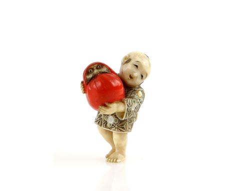 A Yasuaki (Homei) School coloured ivory netsuke of a boy, carrying a large red Daruma Doll, signed YasutakaProvenance: The Pr