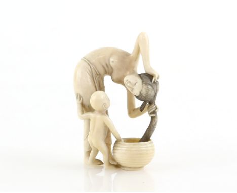 A stained ivory okimono carved as a girl washing her hair beside a standing child, about 6cm high, 20th CenturyProvenance: Th