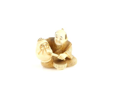 An ivory netsuke of a Daruma Doll maker, signed KozanProvenance: The Property of a Lady. From a Private Collection acquired b