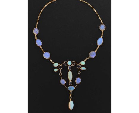 Opal and sapphire pendant necklace in the Arts and Crafts manner, openwork sinuous design, the pendant set with ten oval cabo