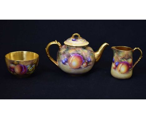 Royal Worcester porcelain fruit decorated teapot, milk jug and sugar basin, comprising teapot of 'cannonball' form, painted b