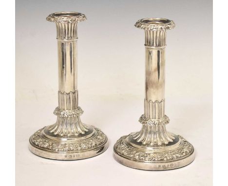 Pair of Victorian silver candlesticks of circular columnar form with floral decoration, Sheffield 1840, sponsor's mark of Hen