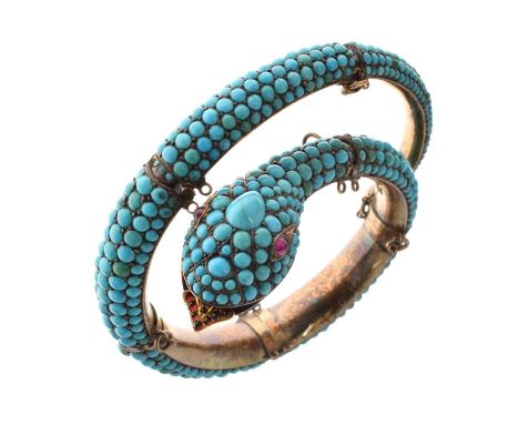 19th century turquoise, ruby and garnet bangle modelled as a snake, two small round cabochon cut ruby eyes, the tongue set wi