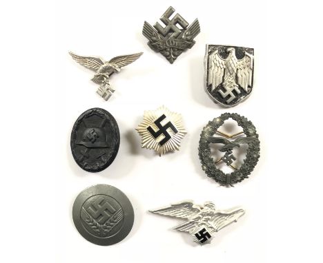 German Third Reich 8 badges. Luftwaffe early cap eagle and swastika ... RLB cap eagle and swastika ... Army topical helmet sh