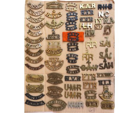 South Africa. 60 brass shoulder titles.  A good varied lot including a few British and a Rand Light Infantry cap badge, most 