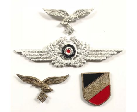 German Third Reich. Luftwaffe cap eagle and winged cockade with tropical helmet eagle and shield. First two bright examples c