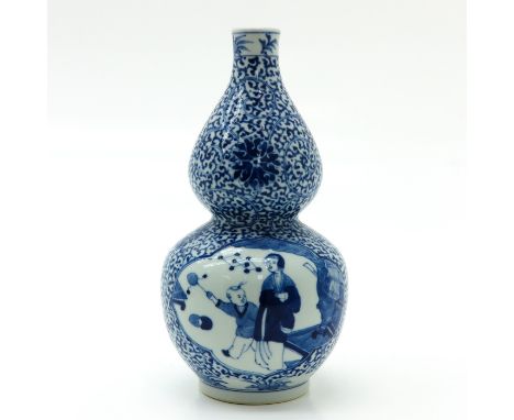 Depicting Chinese lady and child playing games, 23 cm. tall.