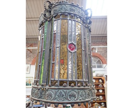 A VICTORIAN STAINED GLASS HALL LANTERN the lobed copper frame with anthemion decoration and scrolling chain fittings 39cm hig