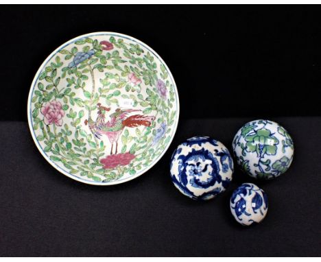 A CHINESE FAMILLE ROSE BOWL with two ceramic balls and an egg