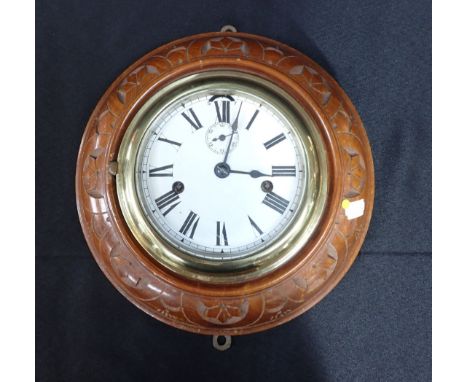 A SHIP'S STYLE WALL CLOCK, WITH CARVED CASE two-train movement, and enamel dial (not running)