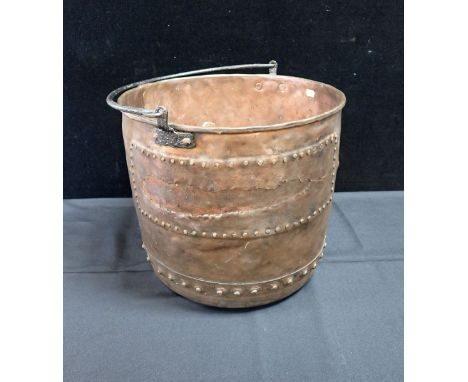 A COPPER LOG BIN WITH IRON HANDLE 45cm dia (large old rivetted patch repair)